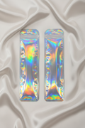 Holographic iridescent packaging bags for DIY beaded accessories on satin background