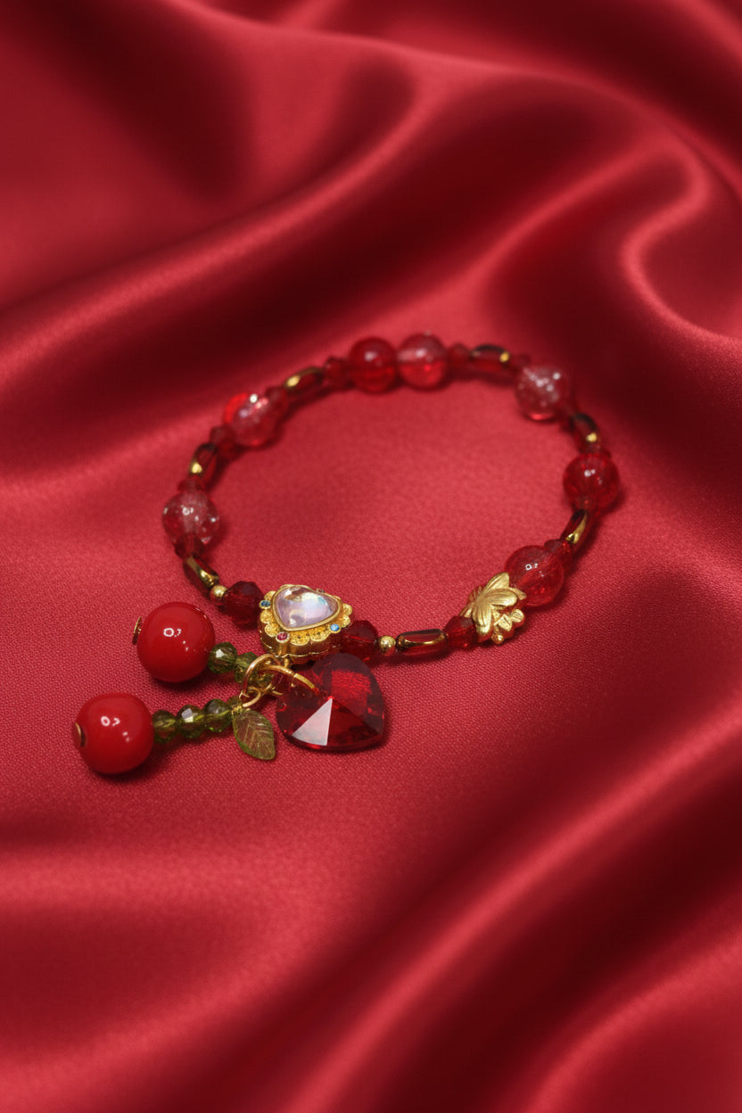 Red beaded bracelet with heart charm and gold accents on satin, handmade DIY accessory