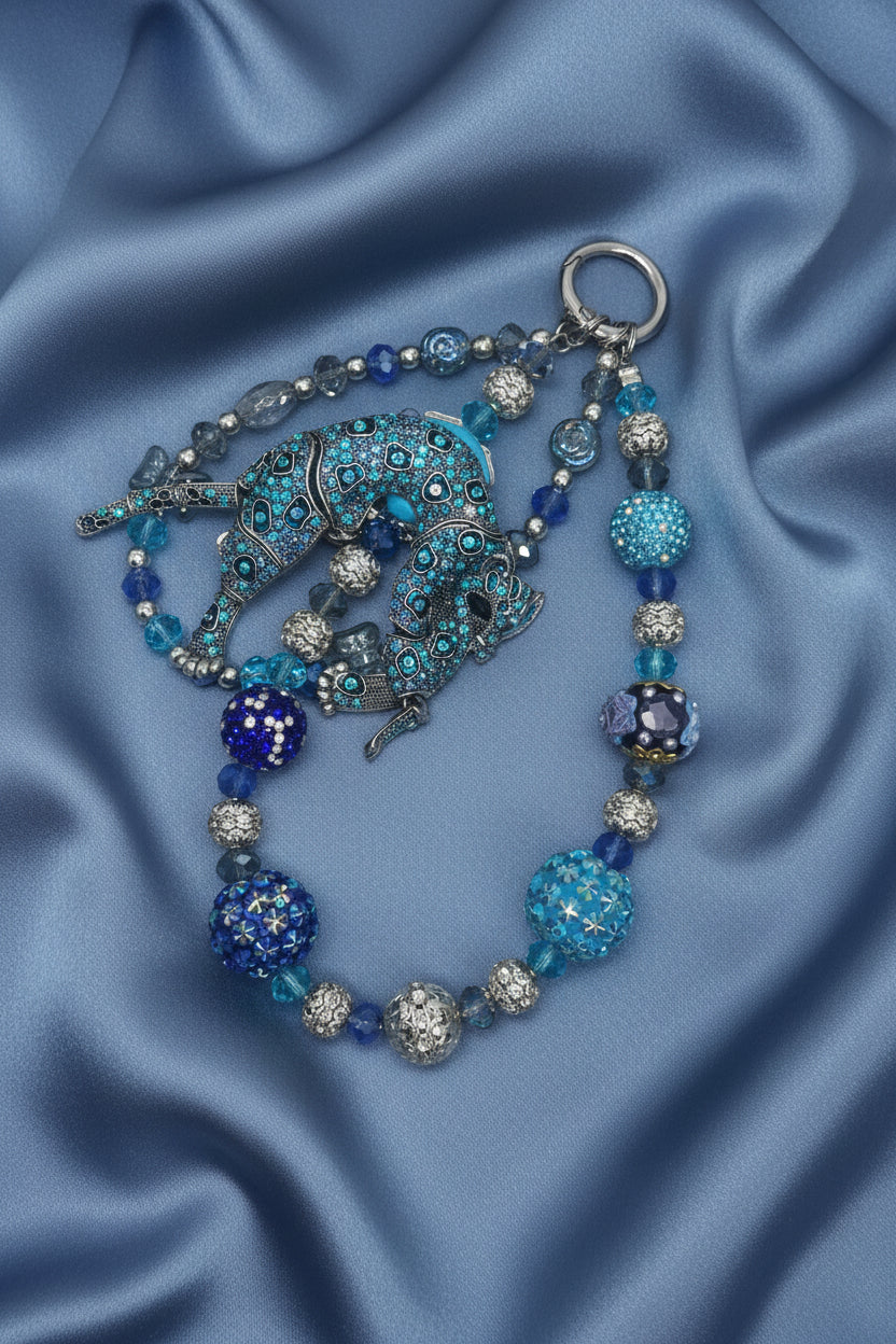 Handmade beaded elephant necklace with blue and silver crystals on satin fabric, DIY jewelry supply