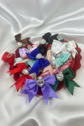 Colorful satin ribbon bows with rhinestone centers, perfect for DIY crafts and handmade accessories