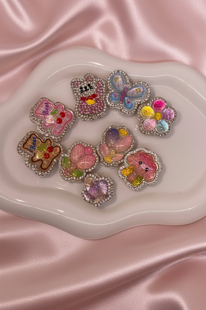 Cute beaded charms with glitter, rhinestones, and pastel designs for DIY accessories and crafts