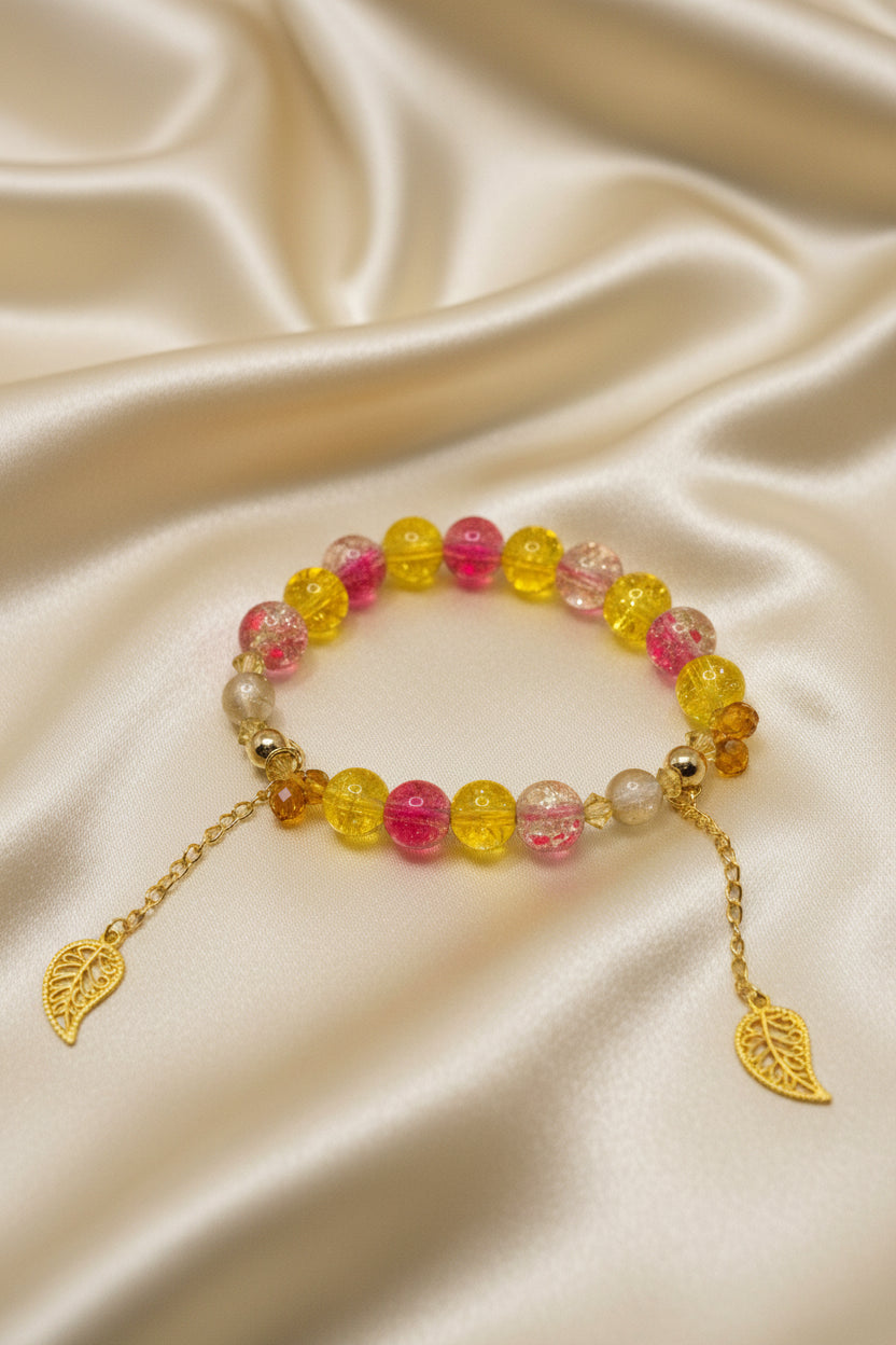Handmade beaded bracelet with pink yellow glass beads and gold leaf charms on silk, DIY craft accessory