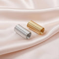 Silver and gold beaded ring supplies for DIY jewelry making on soft satin fabric