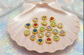 Colorful heart-shaped beaded charms in gold settings, perfect for DIY jewelry making and handmade crafts