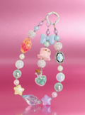 Handmade beaded phone charm with pastel stars, pearls, and cute charms for DIY accessories