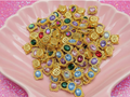 Colorful beaded charms with gold settings for DIY jewelry making and crafting projects